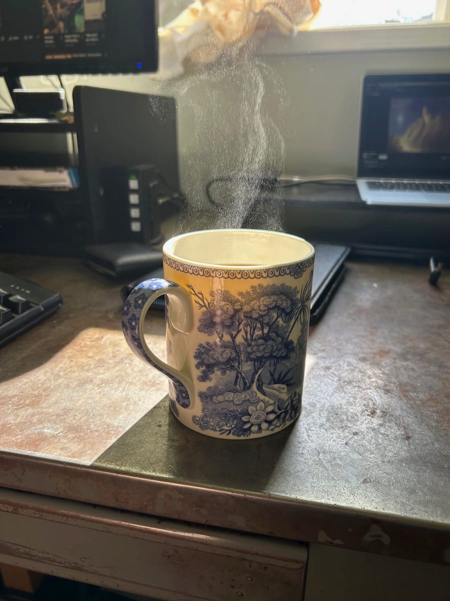 Sunlight through the steam rising off a mug of coffee.